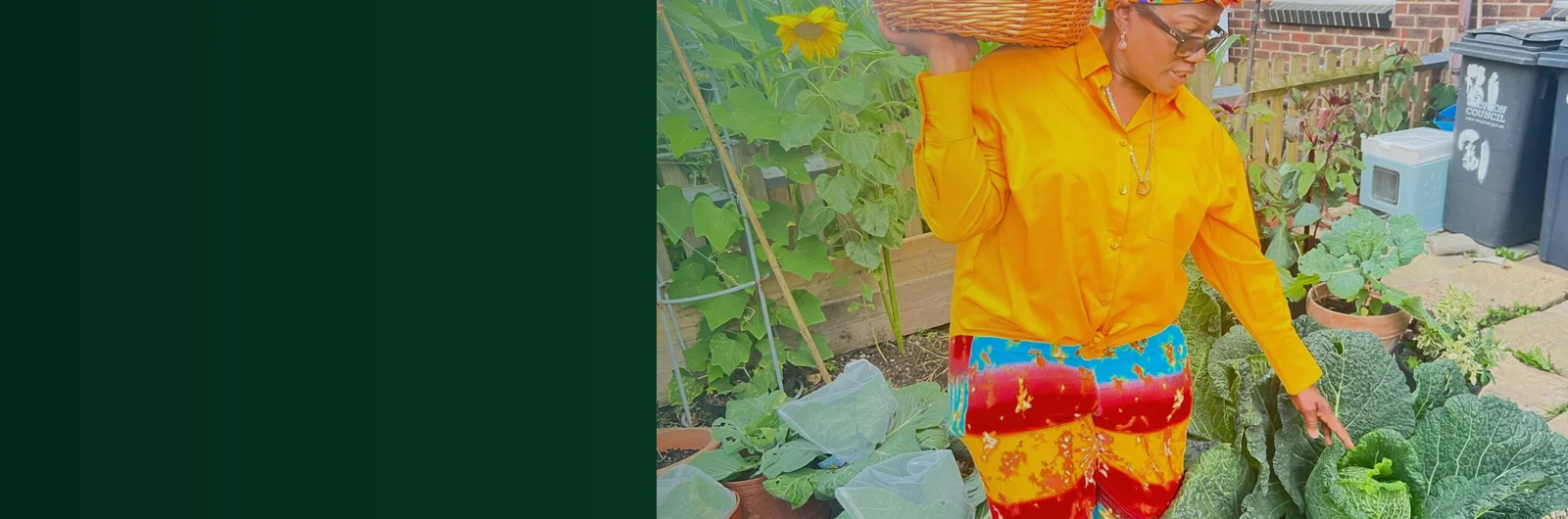 Donna carrying her harvest basket in the garden